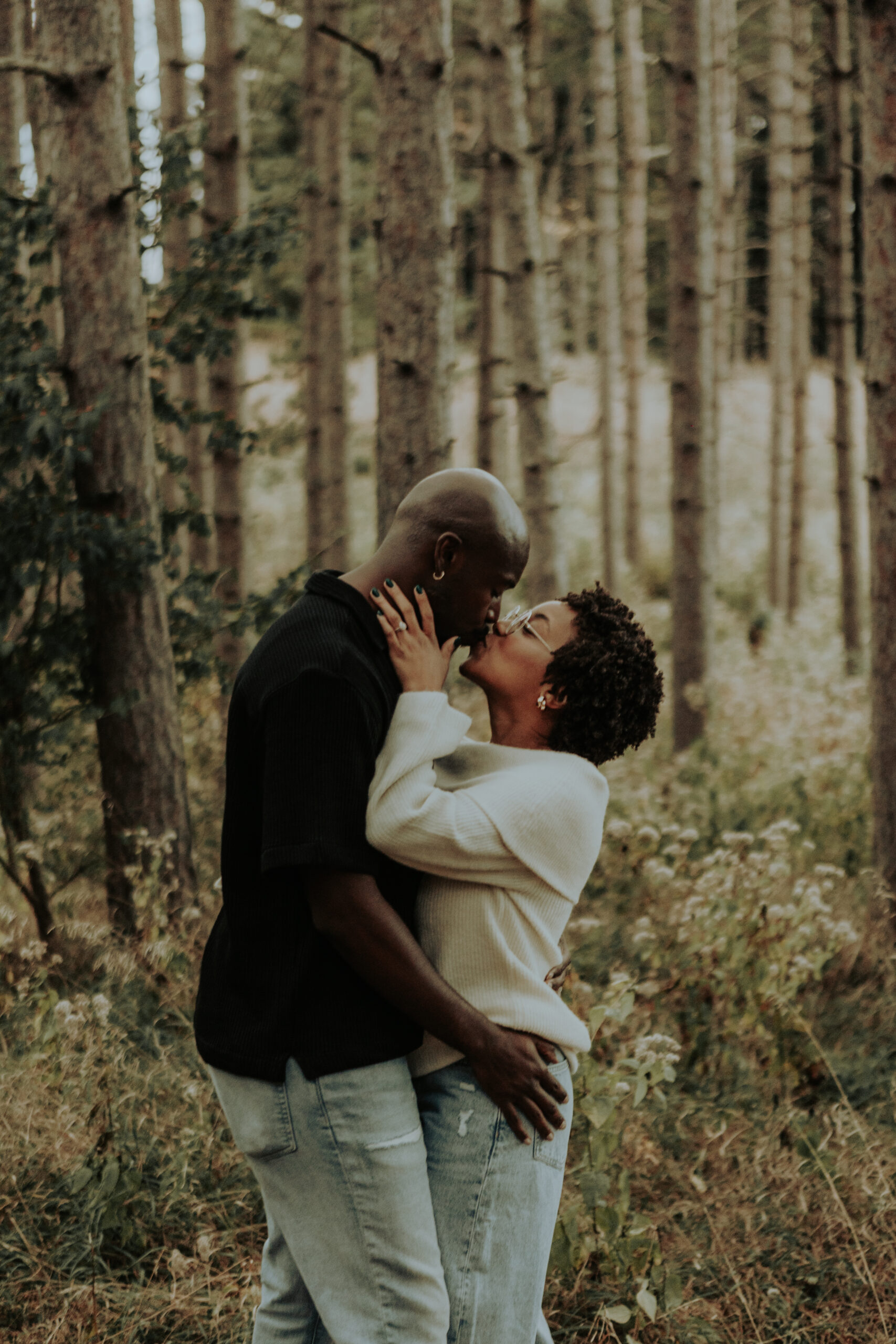 A warm, golden-hour couples session at Veterans Acres featuring Halee & Tyler, past wedding clients now celebrating life together with their two dogs