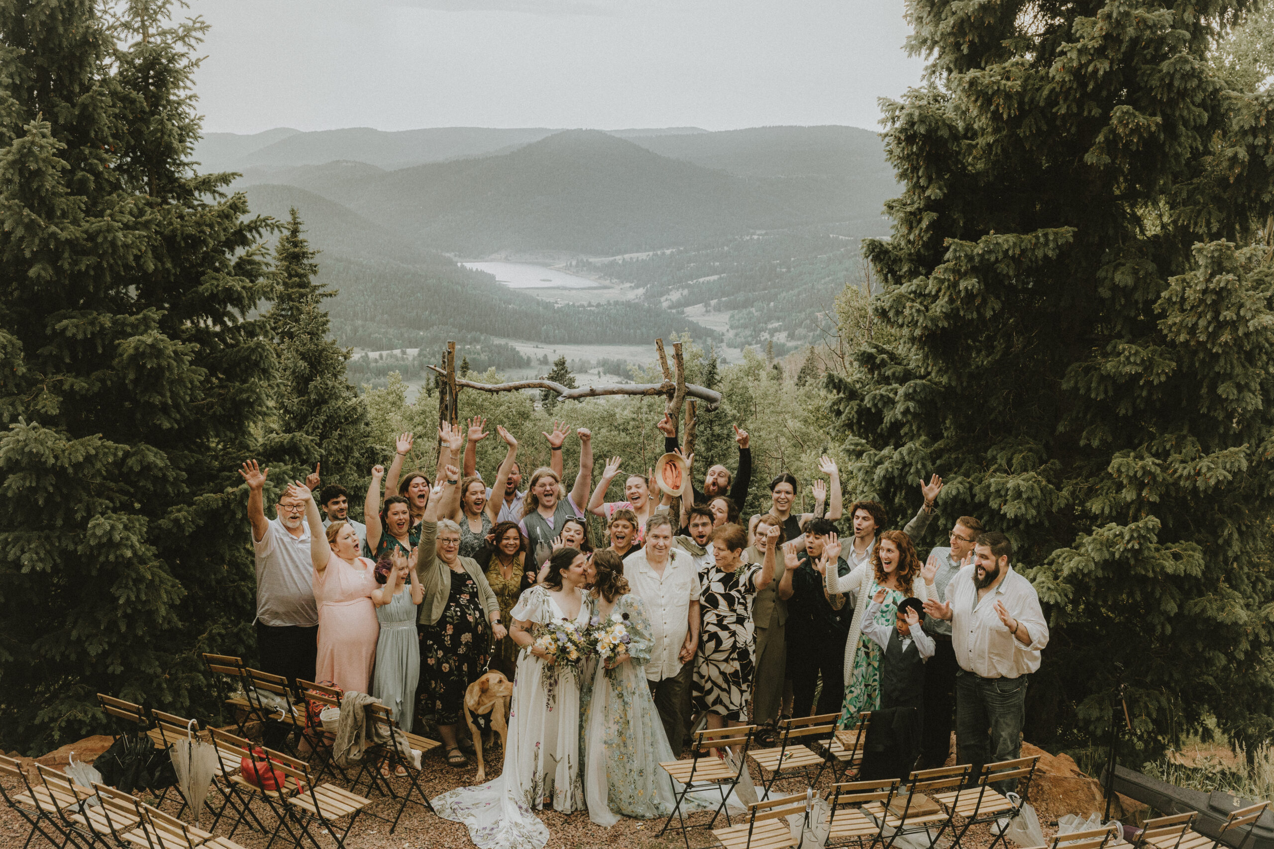Two brides celebrating with their loved ones in the mountains of Victor, Colorado